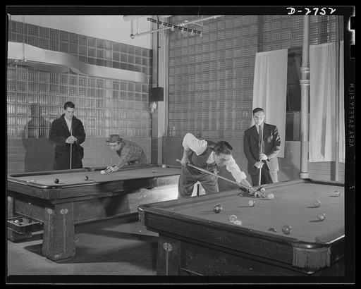 Fiberglass manufacture, Owens-Corning, Toledo, Ohio. Fiberglass workers in a plant of the Owens-Corning Fiberglass Corporation relax during the lunch hour. The plant is on a twenty-four hours a day, seven days a week production basis