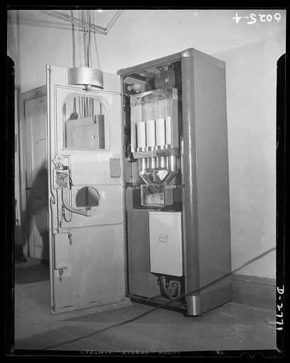 Conversion. Soft drink dispenser plant. Peacetime product of an Eastern manufacturing firm which now produces dies for Democracy. Operating under prime and sub-contracts, this firm makes precision tools, brass quadrants, etc., for Uncle Sam's armed forces. No more soft drink dispensers, orange juice