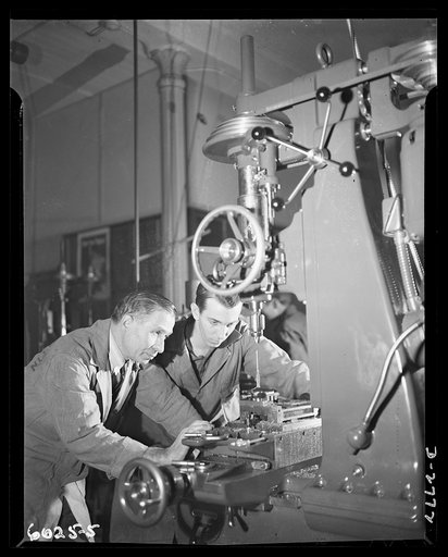 Conversion. Soft drink dispenser plant. War production knows no age. An elderly and a young employee of an Eastern manufacturing concern, now converted to production of precision tools and brass quadrants, jig-bore a bullet die. Bristol and Martin Company, New York, New York