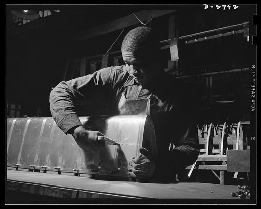 Conversion. Auto body plant. He used to be an automobile worker, but he's one of Uncle Sam's war workers these days, with the conversion of his company to the production of airplane parts. In the picture above, he's assembling part of a wing section. Briggs Manufacturing Company, Detroit, Michigan