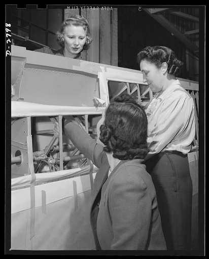 Conversion. Auto body plant. A job often delegated to women in aircraft manufacture is touching up metal braces on ailerons with paint before wing structure is completed. This picture was taken in one of America's automobile body plants newly converted to airplane production. Briggs Manufacturing Co