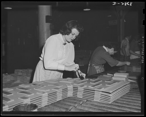 Transformer manufacture. Preparation of insulating board used between copper coils on distribution transformers is done by women employees of a large Eastern electrical company. These young women are extremely valuable to Uncle Sam, because the product they are making is used in almost every phase o