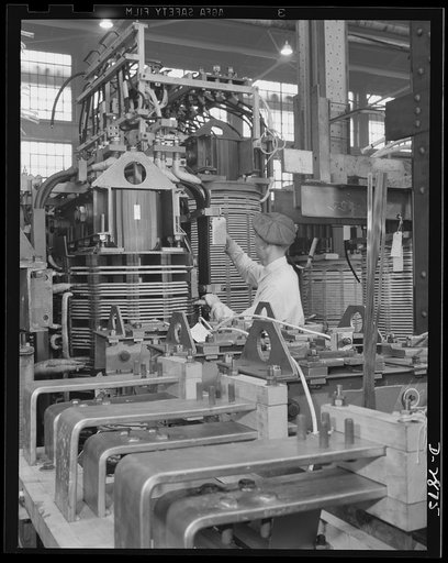 Transformer manufacture. Before transformer coils are wound, condenser plates must be inspected. These transformers are vital to war production and are used to produce power in almost every phase of America's war effort. Westinghouse, Sharon, Pennsylvania