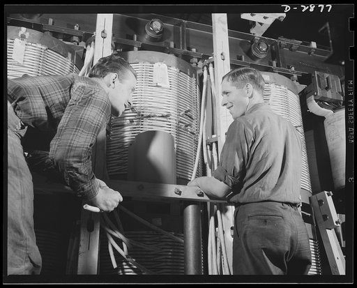Transformer manufacture. Checking the rigging of big power transformers is a skilled job and one that's extremely important to America's war effort these days. Transformers are essential to almost every phase of war Production. Westinghouse, Sharon, Pennsylvania
