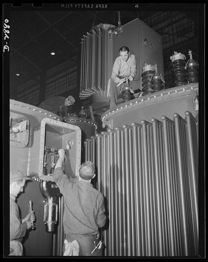 Transformer manufacture. Fitting up outer parts of giant transformers is one of the skilled jobs done by employees of a large Eastern electrical company. The demand for power transformers has increased in proportion to America's ever-increasing war production. Westinghouse, Sharon, Pennsylvania