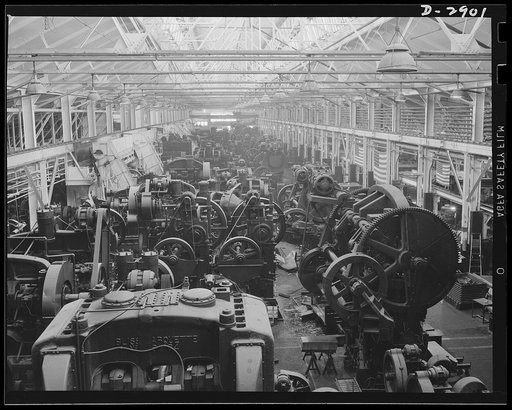 Conversion. Automobile plant. Machines that pressed out fenders and hoods for that family sedan of yours are having a brief respite before their conversion to production of tanks for Uncle Sam's army. Chevrolet Motors, Detroit, Michigan