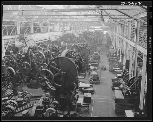 Conversion. Automobile plant. Machines that pressed out fenders and hoods for that family sedan of yours are having a brief respite before their conversion to production of tanks for Uncle Sam's army. Chevrolet Motors, Detroit, Michigan