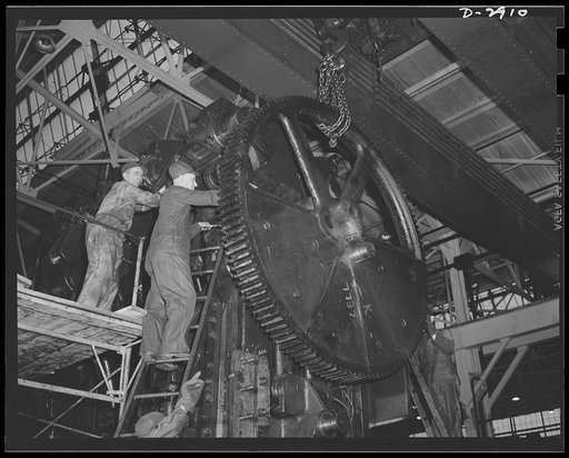 Conversion. Automobile plant. Reassembling a huge 90T96 Cleveland press to perform a major operation in the production of hood panels for 4 x 4 army trucks. The 120-ton machine was moved piece by piece from another part that is being completely dismantled for conversion to other war production. Chev