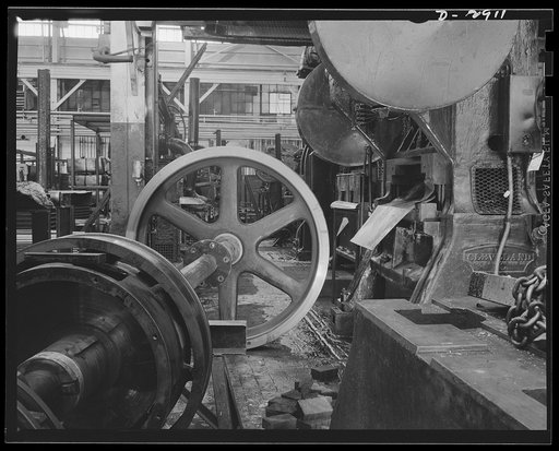 Conversion. Automobile plant. A back shaft that holds the flywheel and clutch mechanism of a 90T96 Cleveland press awaits assembly into the big 120-ton machine. This press will perform a major operation on hood panels for 4 x 4 army trucks. It was moved piece by piece for another plant that is being