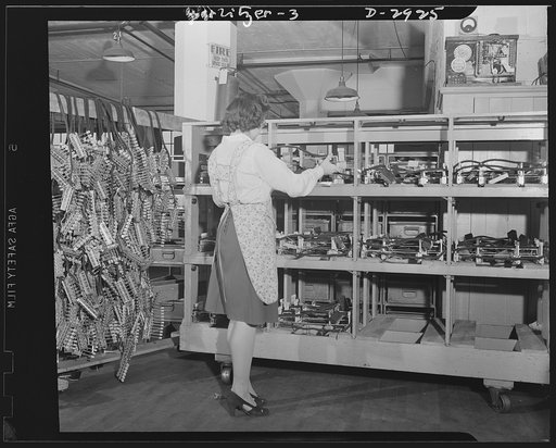 Conversion. Jukebox plant. Completed push-button panels for jukeboxes are stacked by an employee of a large Eastern concern whose product will shortly switch from amusement devices to electrical equipment for Uncle Sam's army and navy. Rudolph Wurlitzer, North Tonawanda, New York