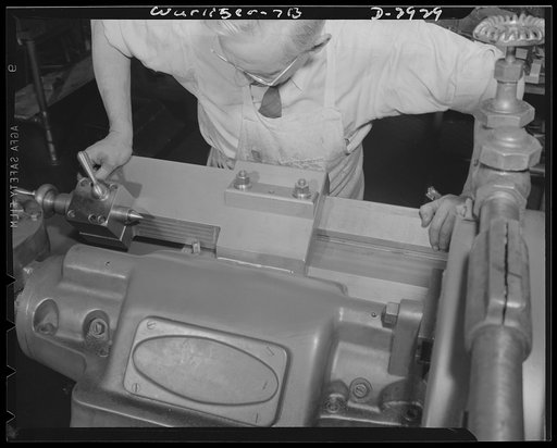 Conversion. Jukebox plant. Production of the drill jig part, pictured here, is included in the conversion of a jukebox manufacturing company to war production. Control instruments based on the jukebox selection device will be manufactured for America's armed forces. Rudolph Wurlitzer, North Tonawand