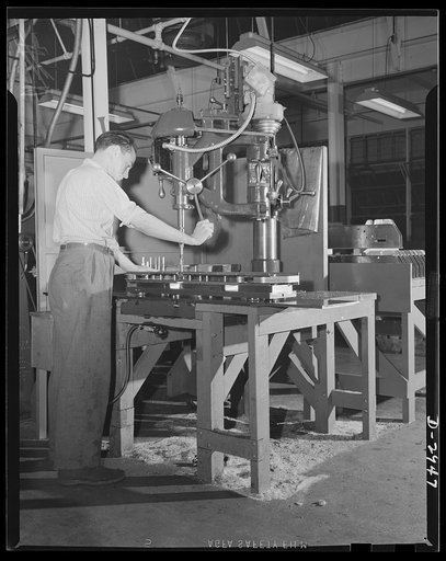 Conversion. Silverware plant. Undergoing conversion to production of bomb shackles from silver tableware, employees of an Eastern plant are helping America deal death to the Axis. Reaming operations on shackle frames are shown above. Air Corps regulations demand extremely fine tolerance. Oneida Ltd.
