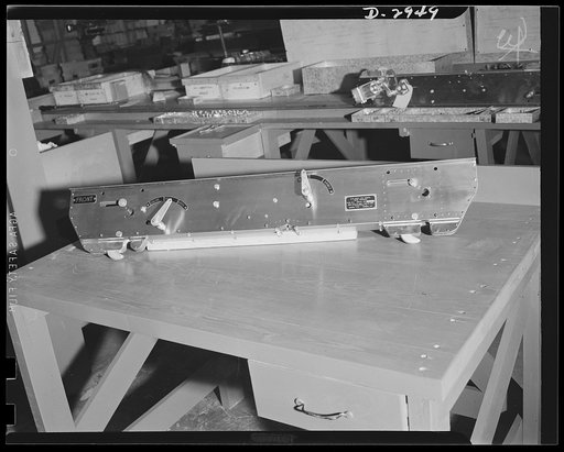 Conversion. Silverware plant. Undergoing conversion to production of bomb shackles from silver tableware, employees of an Eastern plant are helping America deal death to the Axis. Completed bomb shackle is shown above. Oneida Ltd., Oneida, New York