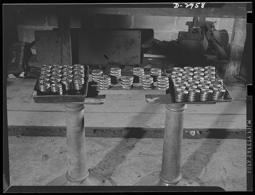 Subcontracting (Braden and Van Fossen Works). These are lock nuts for Navy destroyer, cut from solid steel bars at the Braden and Van Fossen Works, Staunton, Virginia. A special set of dies, jigs and furring tools were built for this job, which was filled in half the time allotted by the prime contr