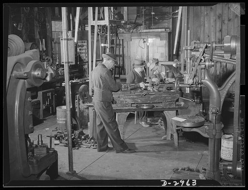 Subcontracting (Beery and Sons). Plant conversion means machine conversion. Here workers at the Harrisonburg, Virginia shop of Beery and Sons are converting a lathe to turn out parts for a war contractor. All the actual work of conversion and the new tools and jigs needed are made in the shop