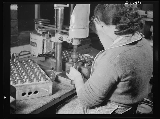 Conversion. Electric shaver plant. This New England plant, whose normal product is electric dry shavers, has now converted its facilities to the production of small, machine tool parts. This drill press which formerly made pressure pinholes in the shearing heads of shavers is now drilling center hol