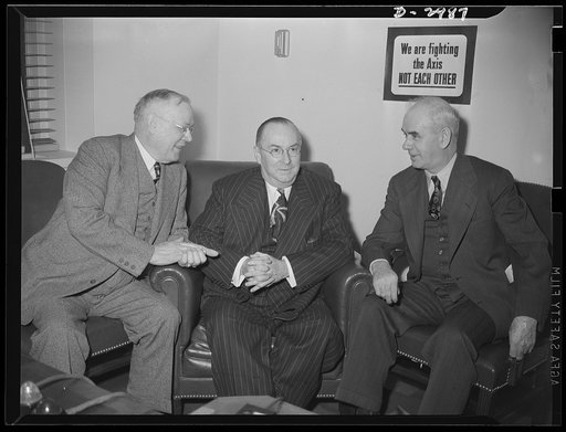 Washington, D.C., March 7, 1942. Donald Nelson, Chairman of the War Production Board meets with the nation's leaders to discuss plans for the production drive. Left to right: William Green, President of the AFL (American Federation of Labor); Donald Nelson, Chairman of the War Production Board; Phil