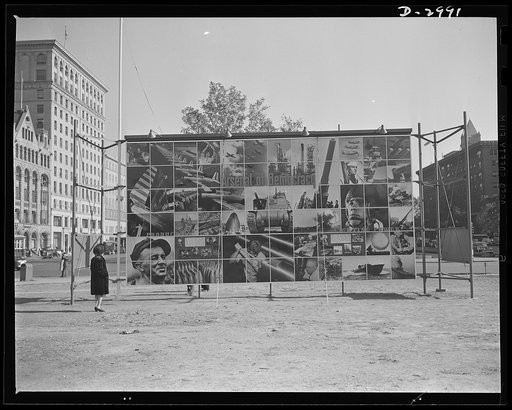 OEM exhibit panel. Office of Emergency Management exhibit panel on display at 14th Street and Pennsylvania Avenue, Washington, D.C., November 1941. The panel was designed by Jean Carlu and executed by the Division of Information, OEM. One side depicted  in a photo-montage, "The Four Freedoms." The o