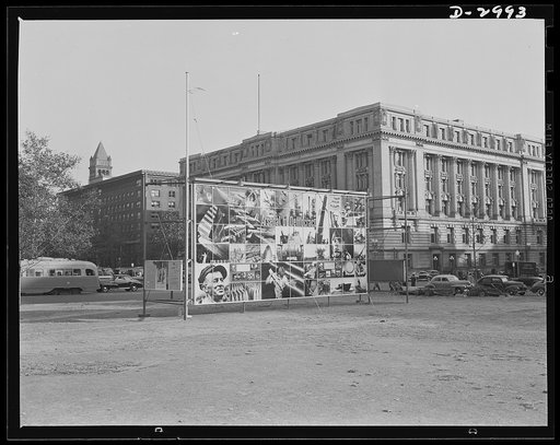 OEM exhibit panel. Office of Emergency Management exhibit panel on display at 14th Street and Pennsylvania Avenue, Washington, D.C., November 1941. The panel was designed by Jean Carlu and executed by the Division of Information, OEM. One side depicted  in a photo-montage, "The Four Freedoms." The o