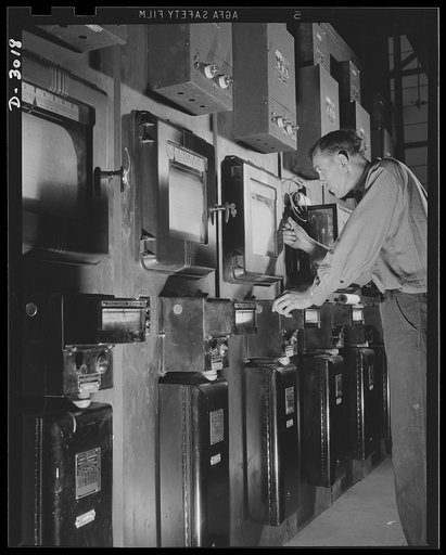 Aluminum casting. To make certain that aluminum is being treated in exact accordance with specifications, this worker sets instruments to the correct temperature on heat treating controls of unit. Aluminum Industries Inc., Cincinnati, Ohio