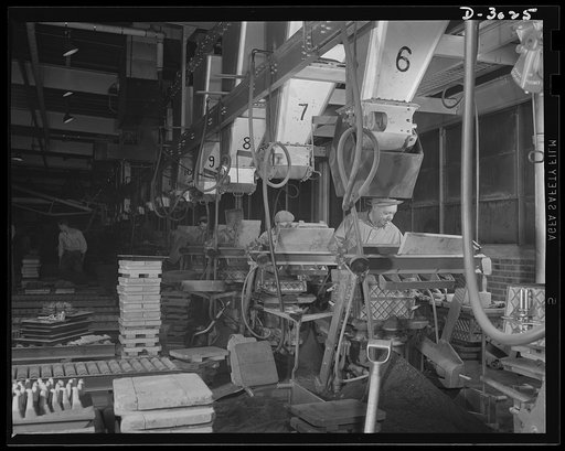 Aluminum casting. Workers in a large Midwest factory at work on smaller molds and castings made at benches. These are jolt squeeze molding machines for hand work. Those numbered hoppers contain conditioned sand. Aluminum Industries, Inc., Cincinnati, Ohio