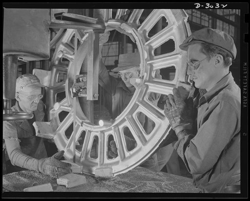 Aluminum casting. Removal of gates and risers from a large ring with a band saw, one of the many operations required before aluminum castings can be called complete. Aluminum Industries Inc., Cincinnati, Ohio