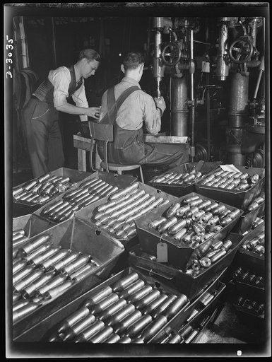 Aluminum casting. In this large Midwest factory converted to production of war essentials two workmen are pictured boring holes in the base of 37-millimeter armour piercing shot where primers will be inserted. Aluminum Industries Inc., Cincinnati, Ohio