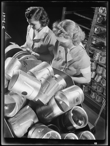 Aluminum casting. The heads of these heat-treated pistons must be spotted prior to Brinnell hardness testing. Young women are employed for this job by a large Midwest aluminum foundry now converted to war production. Aluminum Industries Inc., Cincinnati, Ohio