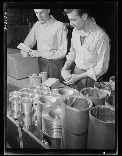 Aluminum casting. Finished pistons are wrapped and packed for shipment to ordnance depots: they're scheduled for use in army jeeps. Aluminum pistons are one product of this giant Midwest factory now converted to war production. Aluminum Industries Inc., Cincinnati, Ohio