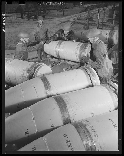 Fort Story coast defense. Soldiers at Fort Story, Virginia, unloading sixteen-inch shells in casemates. The rope tied around the soft copper rotating band