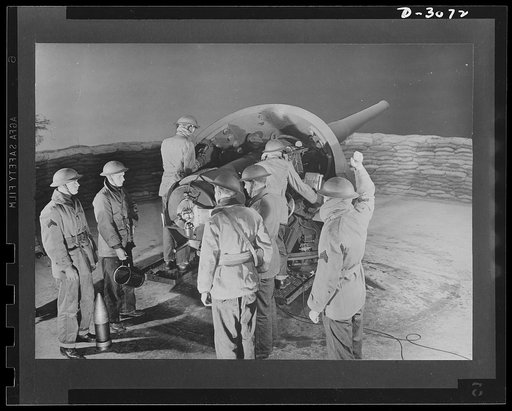 Fort Story coast defense. A six-inch gun ready to fire on enemy craft. Soldiers are loading the gun; when the sergeant's arm comes down, that's the signal to fire
