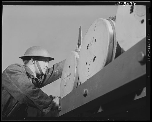 Fort Story coast defense. One of Uncle Sam's fighting men at Camp Story, Virginia, inspects the base of a sixteen-inch projectile