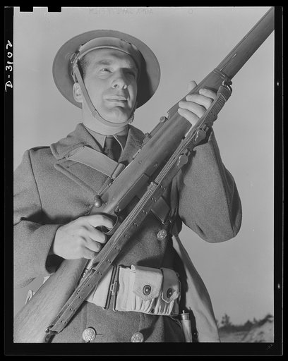 Fort Story coast defense. Let the enemy beware. This Fort Story, Virginia, soldier looks as though he means business...and he does