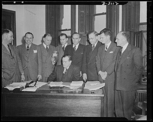 War Production Board Sugar Policy Committee. This shows the first meeting of the newly formed War Production Board Sugar Policy Committee. The committee consists of representatives of light government agencies concerned with the sugar problem. The committee was formed to exchange information and to 