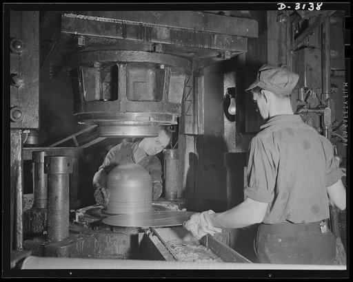 Conversion. Beverage containers to aviation oxygen cylinders. The first step in the manufacture of high-altitude-flying shatterproof oxygen cylinders in the metal department of a large rubber factory is the forming or stamping of the shell. Stainless steel sheets are blanked or cut into discs(left f