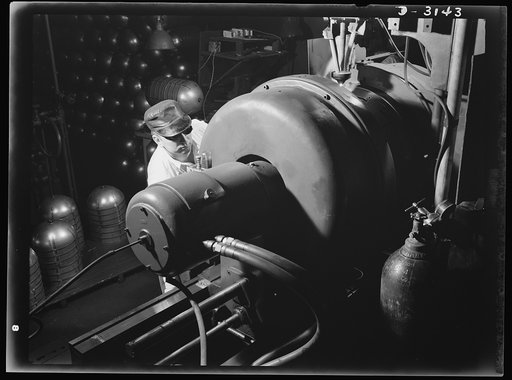 Conversion. Beverage containers to aviation oxygen cylinders. Before completion of the fourth and final welding operation in the manufacture of shatterproof oxygen cylinders for high altitude flying, all straps are subjected to physical tests to determine the strength of the weld. Occasional radiogr