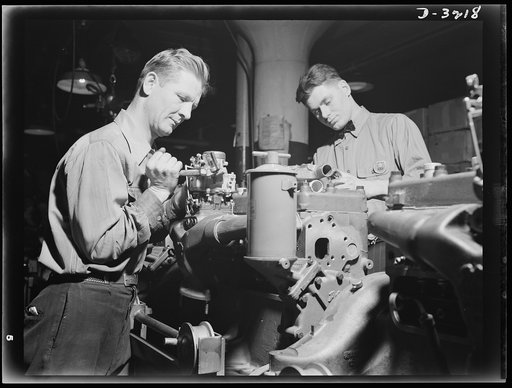 Halftrac scout cars. Under the skilled hands of trained workers, the engine for an Army halftrac scout car begins to take form. Each of its parts is built to stand up under the conditions imposed by modern warfare on mechanized equipment. White Motor Company, Cleveland, Ohio