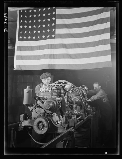 Halftrac scout cars. Another engine for an Army halftrac scout car begins to take form. They're coming through faster and faster every day--engines and cars, both--as the Midwest plant turning out the complete jobs gives everything it has to speeding production. White Motor Company, Cleveland, Ohio