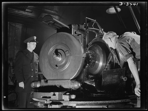 Good men, good machines, good materials mean good gears for the rear axles of halftrac scout cars now being produced for our Army in an Ohio truck plant. White Motor Company, Cleveland, Ohio