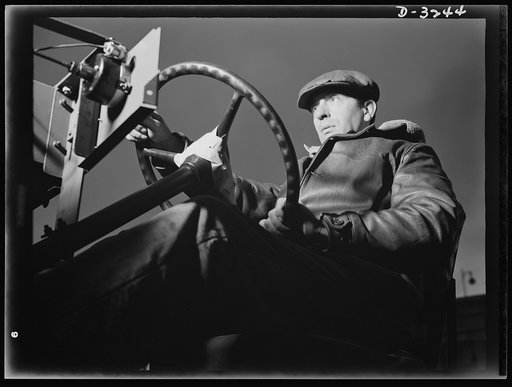 The chassis of an Army halftrac scout car get a workout. When this test driver at a large Midwest plant has put the machine through its paces, he'll know if the machine meets the exacting specifications of the Army. White Motor Company, Cleveland, Ohio