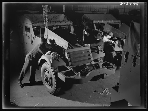 The ordnance department must satisfy itself that every halftrac scout car turned over to it by a Midwest manufacturer is fit for Army duty. The department's own inspector gives it a thorough going over from bumper to bumper. White Motor Company, Cleveland, Ohio