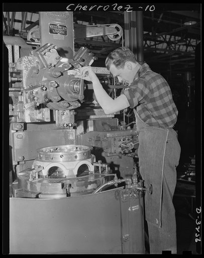 Auto conversion to airplane engines. On the site of an automobile assembly line, this battery of Bullard boring machines used in manufacturing of airplane engines, now stands. With normal operations of this automobile factory suspended for the duration, conversion to war production was a gigantic ta