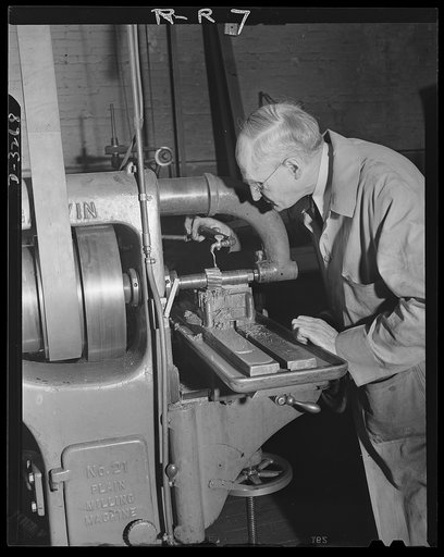 Oil burners to machine gun parts. Machining of a fixture to be used on milling machines which have been converted from production of oil burners to the manufacture of small precision parts for machine guns. Location: a factory in upper New York State. Reif-Rexoil Company, Buffalo, New York