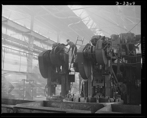 A huge forge manner is taken off its regular peacetime duties in an automobile plant and put on war Production. When workmen have finished their conversion job, the big fellow began shaping crankshafts for defense. Oldsmobile, Lansing, Michigan