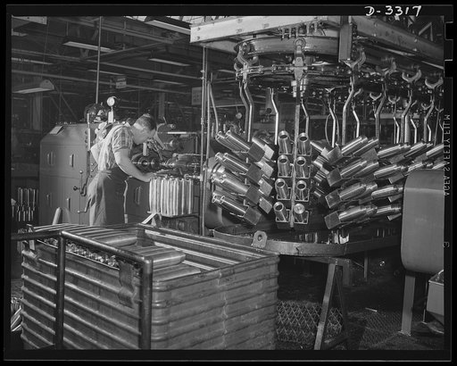 Important machine operations in the manufacture of shells for the Army are performed in a converted automobile plant where workers are accustomed to the fast and accurate production on highly developed machines. Oldsmobile, Lansing, Michigan