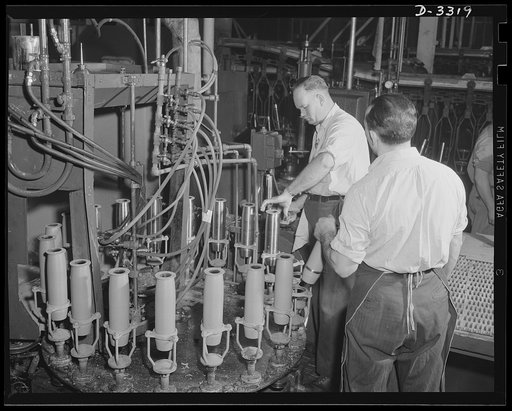Conversion. Auto plant to 75- and 155-mm shell production. The work of pointing shells must be conducted with care. Shells must be perfect to insure accurate performance. But high standards of accuracy are nothing new to the former automobile plant where these shells are being made. Oldsmobile, Lans