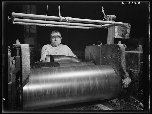 Rubber stock for the track treads of scout cars and other Army halftrac vehicles is milled in one Ohio tire plant. All rubber firmly "welded" to the steel parts is formed into one tough durable piece. Goodrich, Akron, Ohio