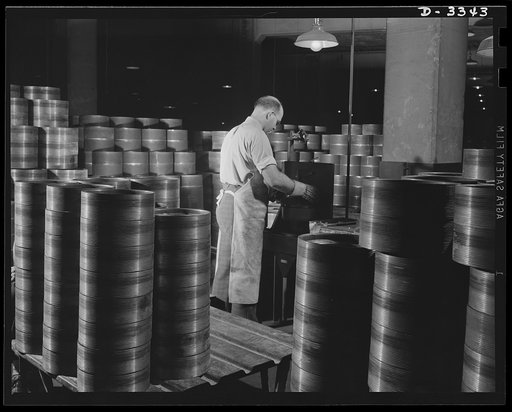 The tracks for Army halftrac cars run over bogie wheels which distribute the load and absorb shock through the springs on which they are mounted. The steel bases for these bogie wheels undergo inspection at a Midwest tire plant engaged in halftrac production. Goodrich, Akron, Ohio