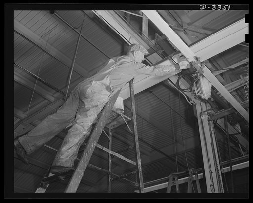Twenty-millimeter machine guns for planes. Tidiness and order contribute to plant morale and efficiency. A former auto plant now turning out machine guns is straining every resource to get top production, but it still keeps the maintenance men busy cleaning and painting the building and equipment. O