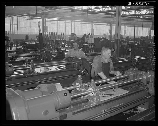 Twenty-millimeter machine guns for planes. Since the days of early American gunsmiths, our arms manufacturers have taken pride in the quality of their work. Today, a skilled worker in a converted auto plant feels that same pride as he bores a machine gun barrel for Air Corps. Oldsmobile, Lansing, Mi